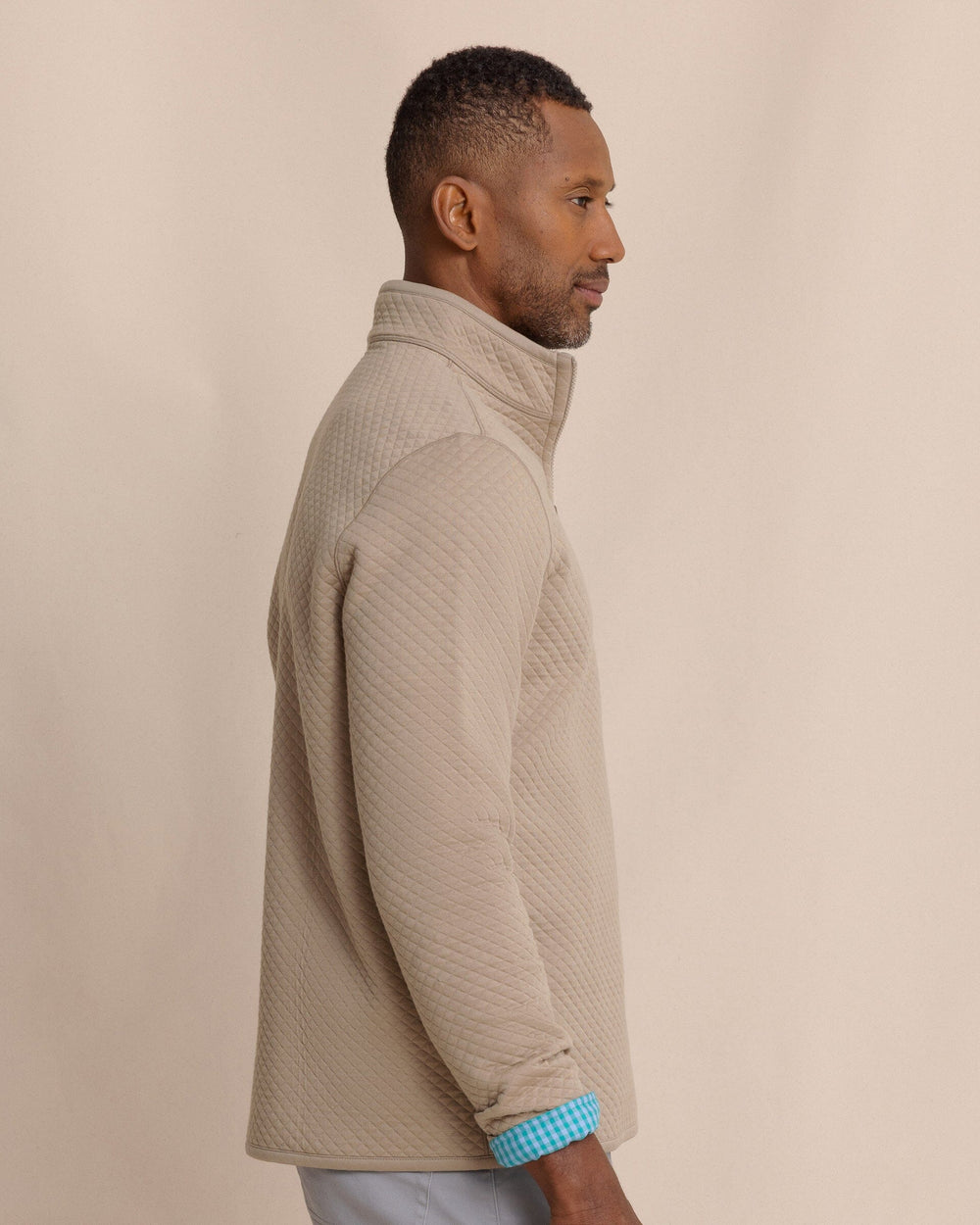The side view of the Southern Tide Oak Island Reversible Quarter Zip by Southern Tide - Sandstone Khaki