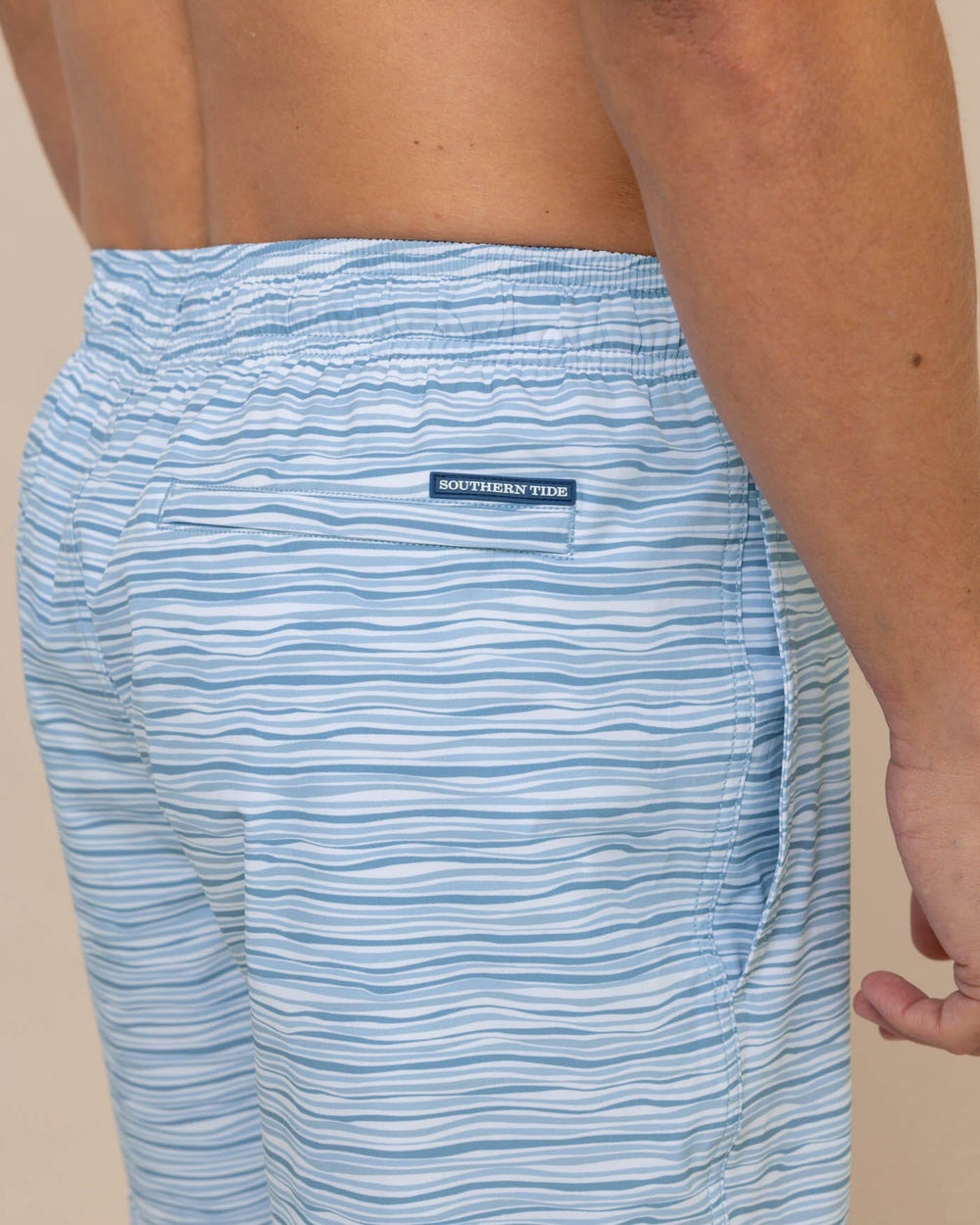 The detail view of the Southern Tide Ocean Water Stripe Swim Trunk by Southern Tide - Subdued Blue
