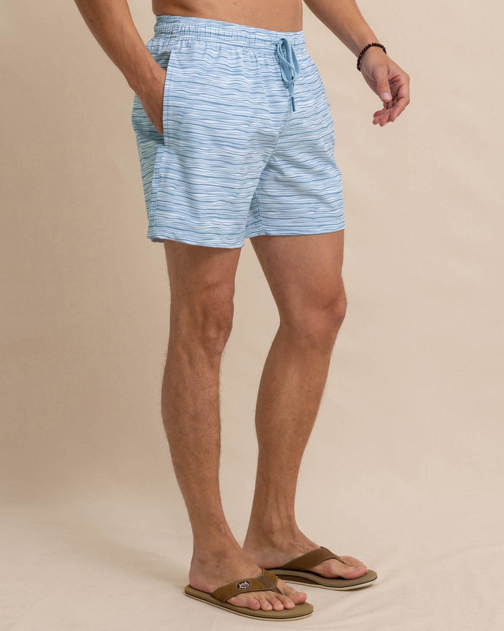 The front view of the Southern Tide Ocean Water Stripe Swim Trunk by Southern Tide - Subdued Blue