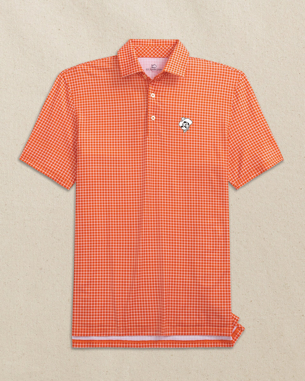 The front view of the Southern Tide Oklahoma State Pistol Pete Driver Dunes Edge Plaid Polo by Southern Tide - Endzone Orange