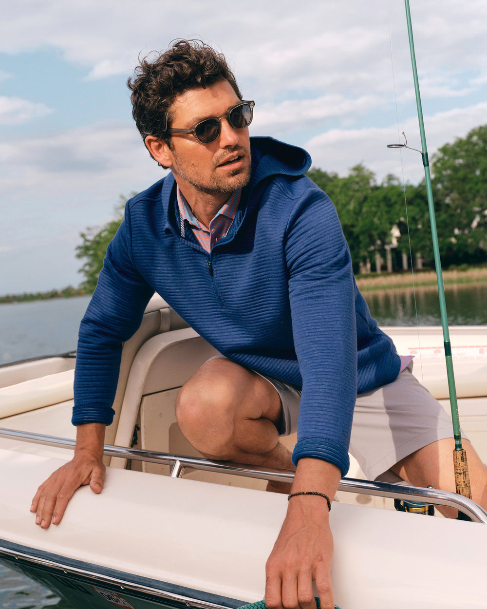 The lifestyle view of the Southern Tide Ottoman Heather Quarter Zip Hoodie by Southern Tide - Heather Nautical Blue