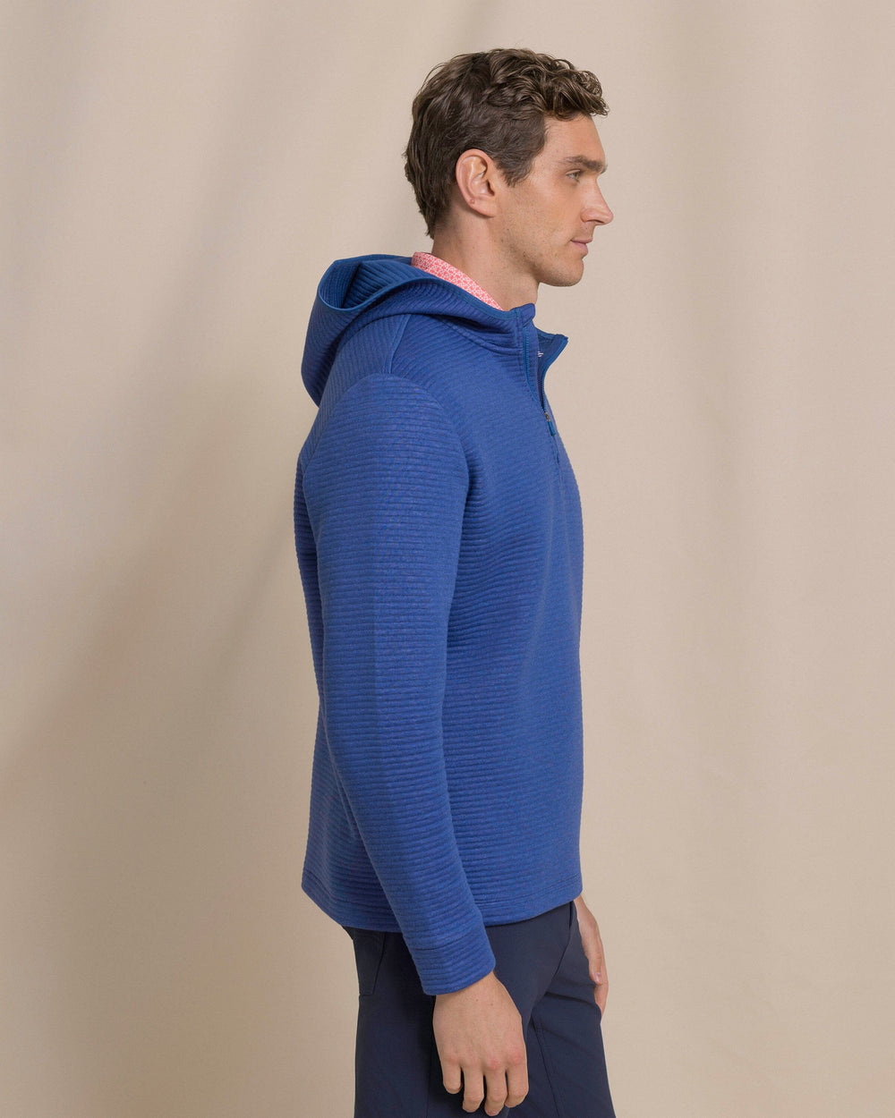 The side view of the Southern Tide Ottoman Heather Quarter Zip Hoodie by Southern Tide - Heather Nautical Blue