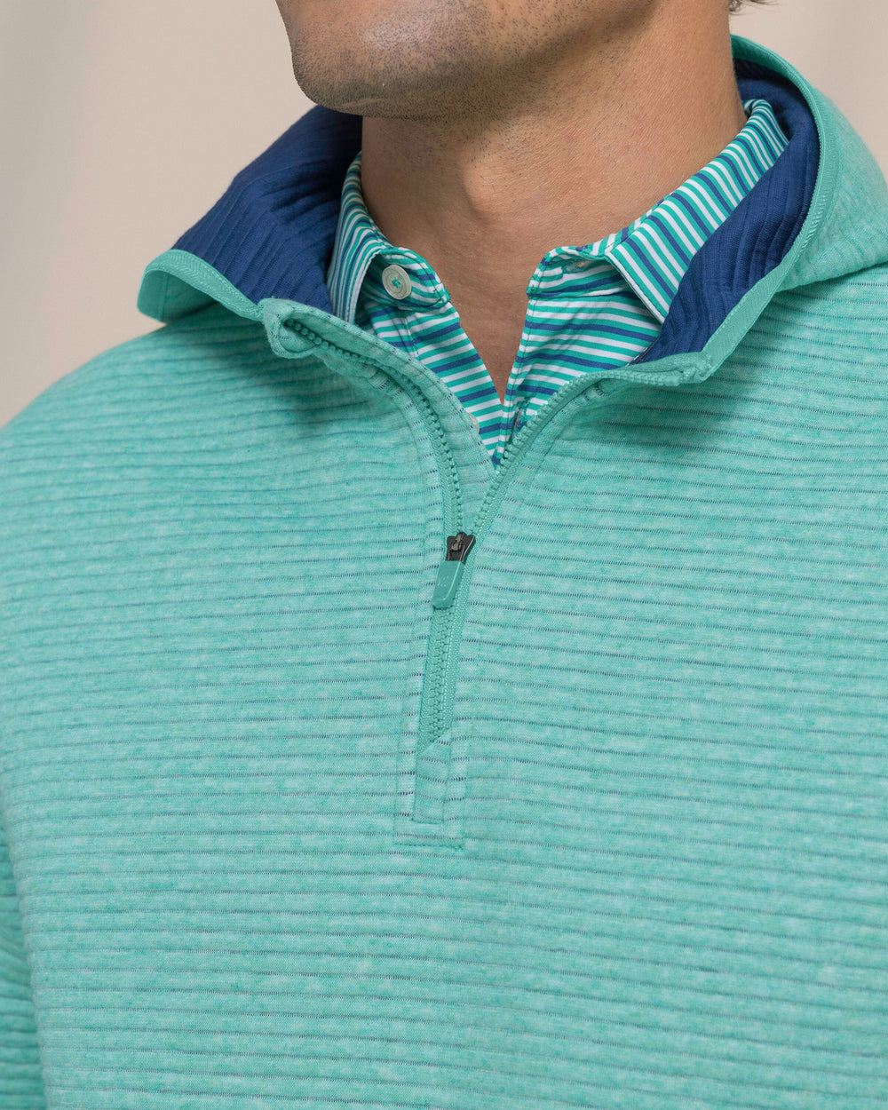 The detail view of the Southern Tide Ottoman Heather Quarter Zip Hoodie by Southern Tide - Heather Persian Green