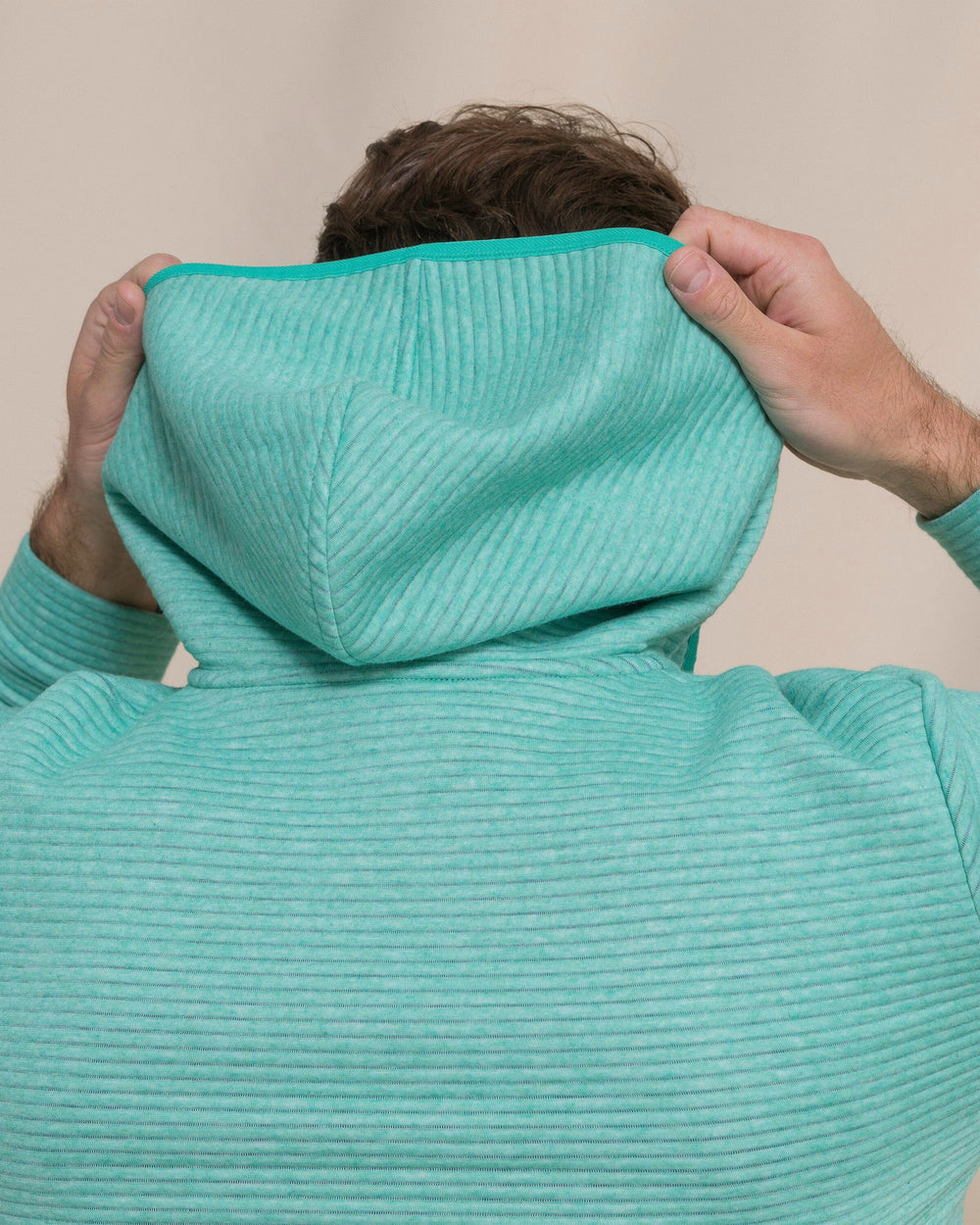 The detail view of the Southern Tide Ottoman Heather Quarter Zip Hoodie by Southern Tide - Heather Persian Green