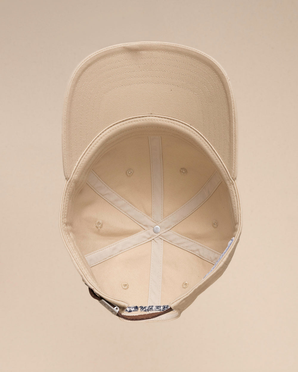 The inside view of the Southern Tide Outline Skipjack Leather Strap Hat by Southern Tide - Sand Dune