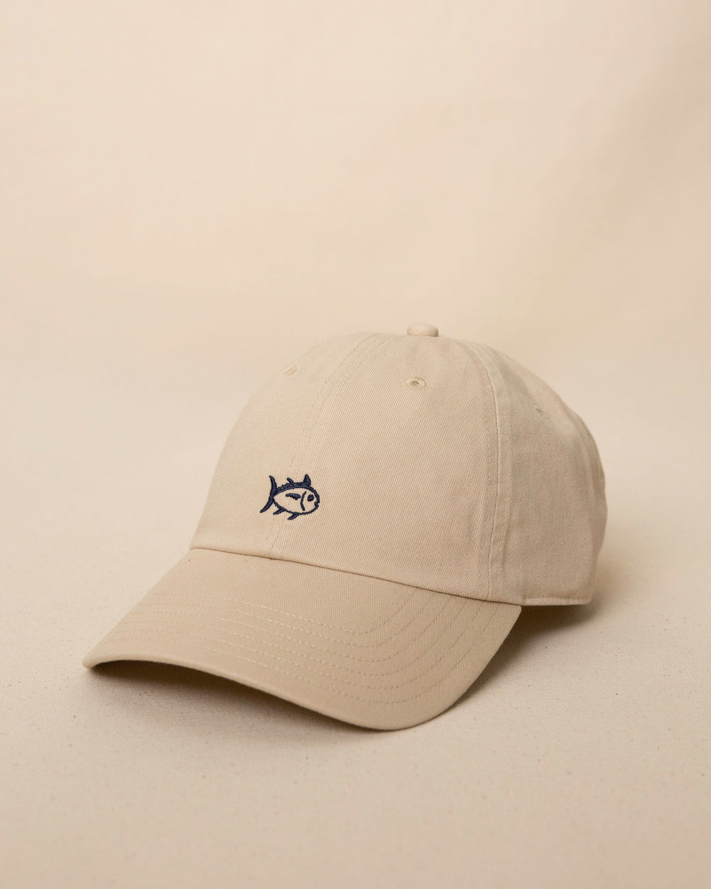 The side view of the Southern Tide Outline Skipjack Leather Strap Hat by Southern Tide - Sand Dune