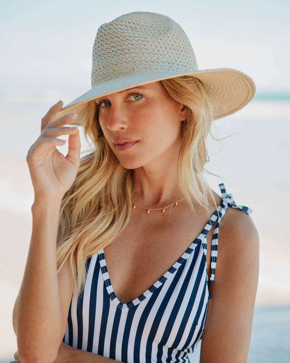 The front view of the Southern Tide Packable Straw Beach Hat by Southern Tide - Natural