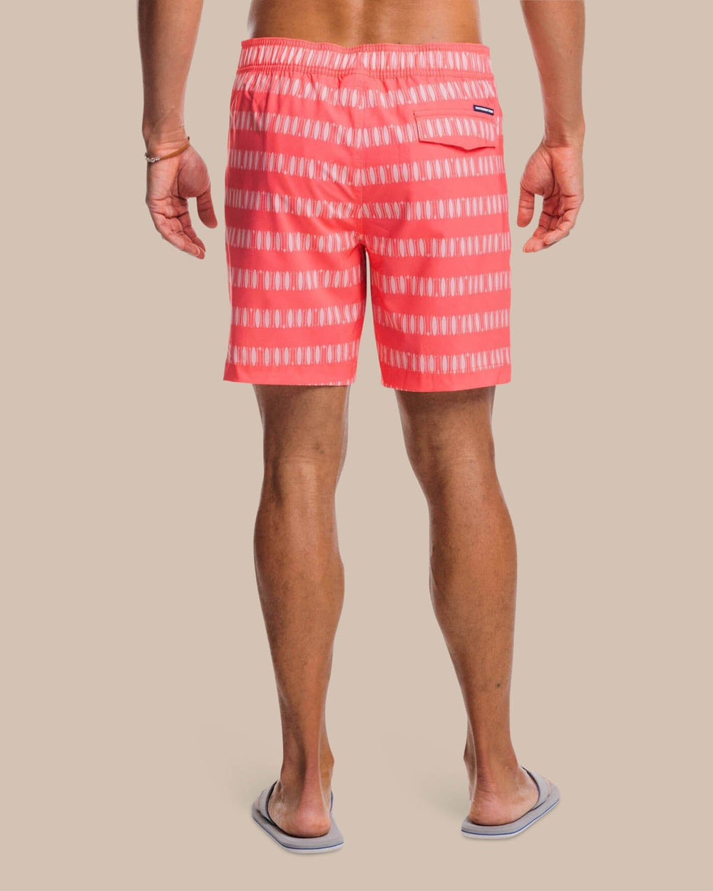 The back view of the Southern Tide Paddlin Out Printed Swim Short by Southern Tide - Sunkist Coral