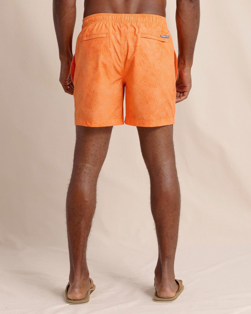 The back view of the Southern Tide Palm-tree-cation Swim Trunk by Southern Tide - Papaya Orange