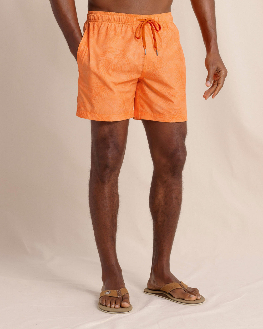 The front view of the Southern Tide Palm-tree-cation Swim Trunk by Southern Tide - Papaya Orange