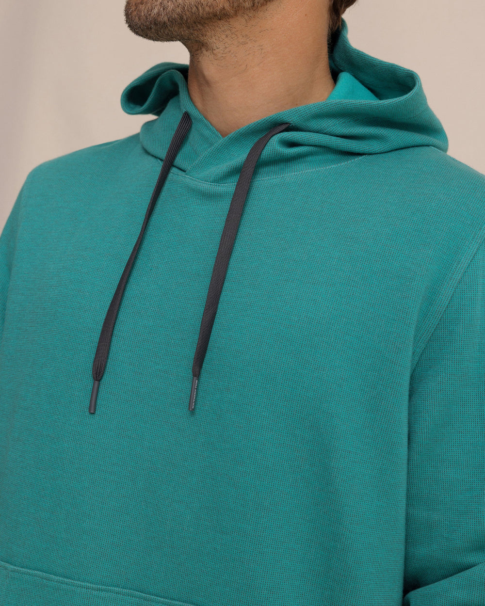 The detail view of the Southern Tide Pearl Cove Fleece Hoodie by Southern Tide - Spruce Shade