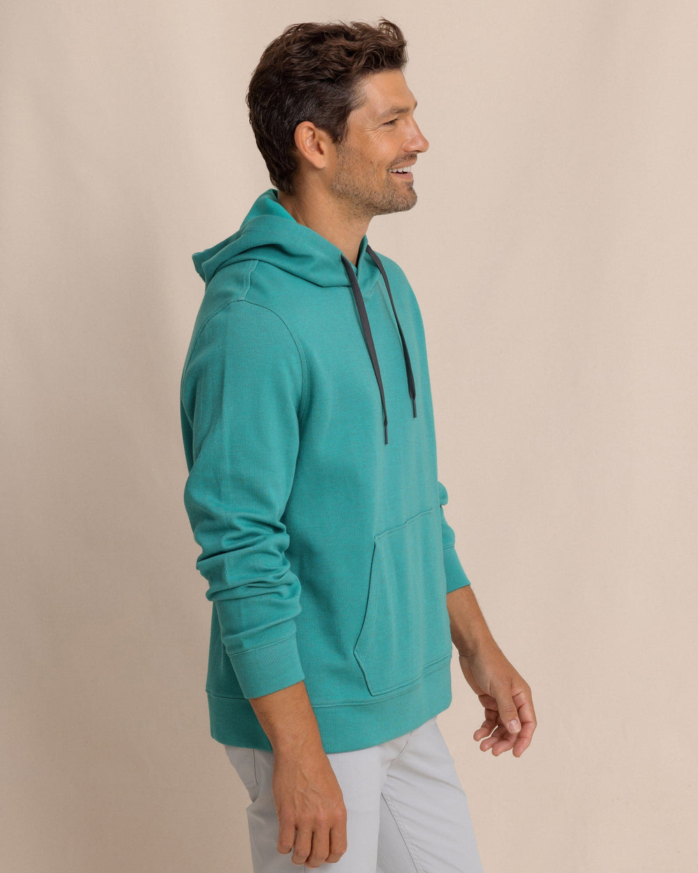 The side view of the Southern Tide Pearl Cove Fleece Hoodie by Southern Tide - Spruce Shade