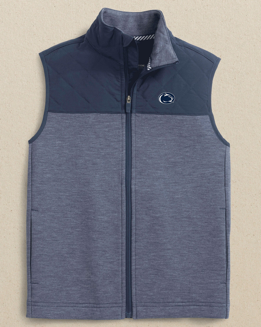The front view of the Southern Tide Penn State Nittany Lions Boys Waterfront Quilted Vest by Southern Tide - Dress Blue
