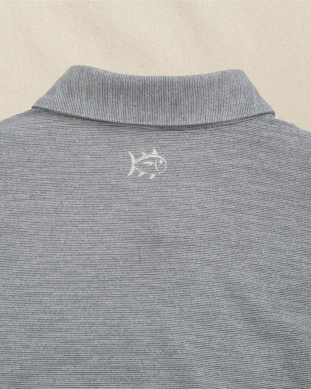 The back detail view of the Southern Tide Penn State Nittany Lions Driver Spacedye Polo by Southern Tide - Navy