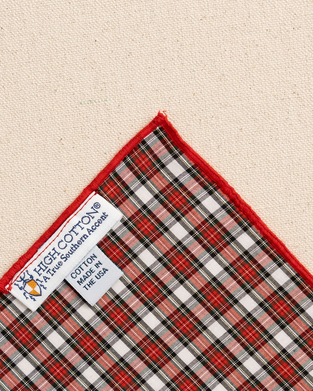 The detail back view of the High Cotton Peppermint Plaid Cotton Pocket Square at Southern Tide - Red