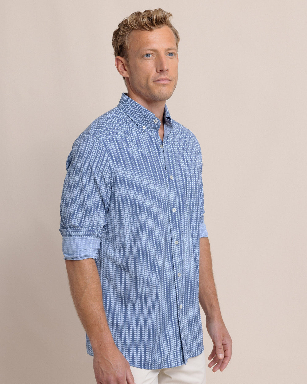 The side view of the Southern Tide Pop Lock and Dock It Intercoastal Long Sleeve Sport Shirt by Southern Tide - Light Indigo