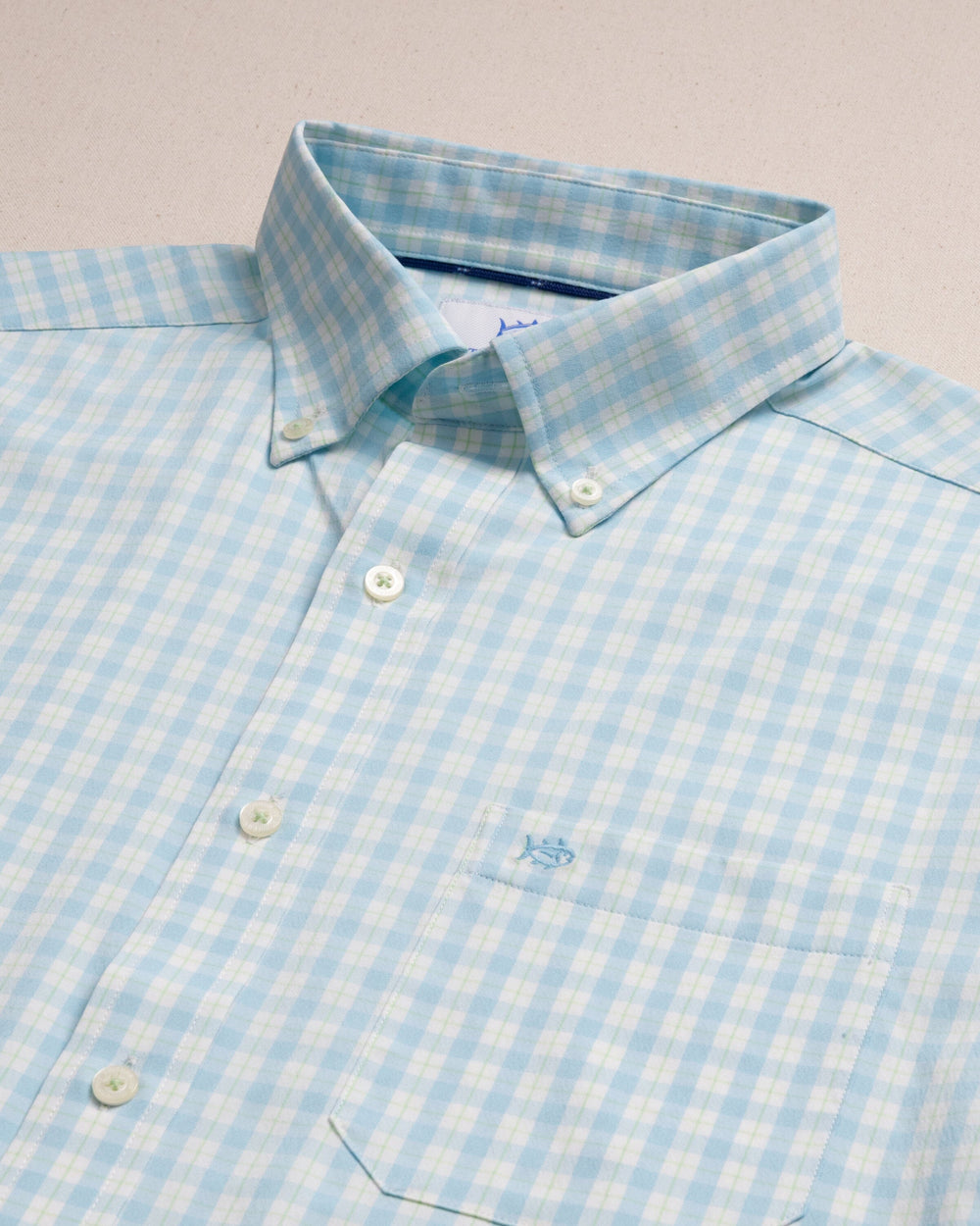 The detail view of the Southern Tide Precheck Plaid Coastal Breeze® Sport Shirt by Southern Tide - Tropical Breeze Blue