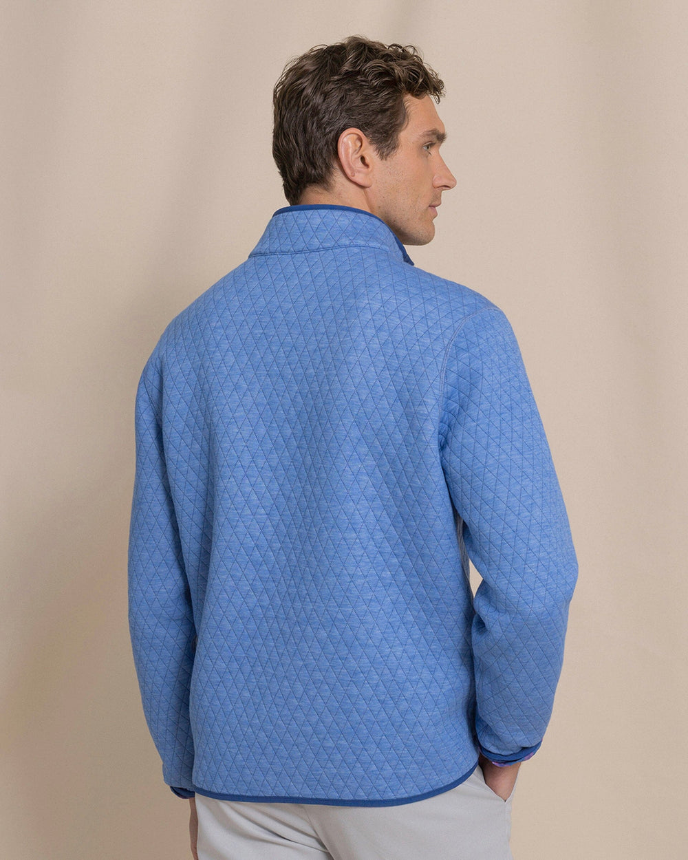 The back view of the Southern Tide Quilted Heather Reversible Quarter Snap by Southern Tide - Heather Ocean Channel