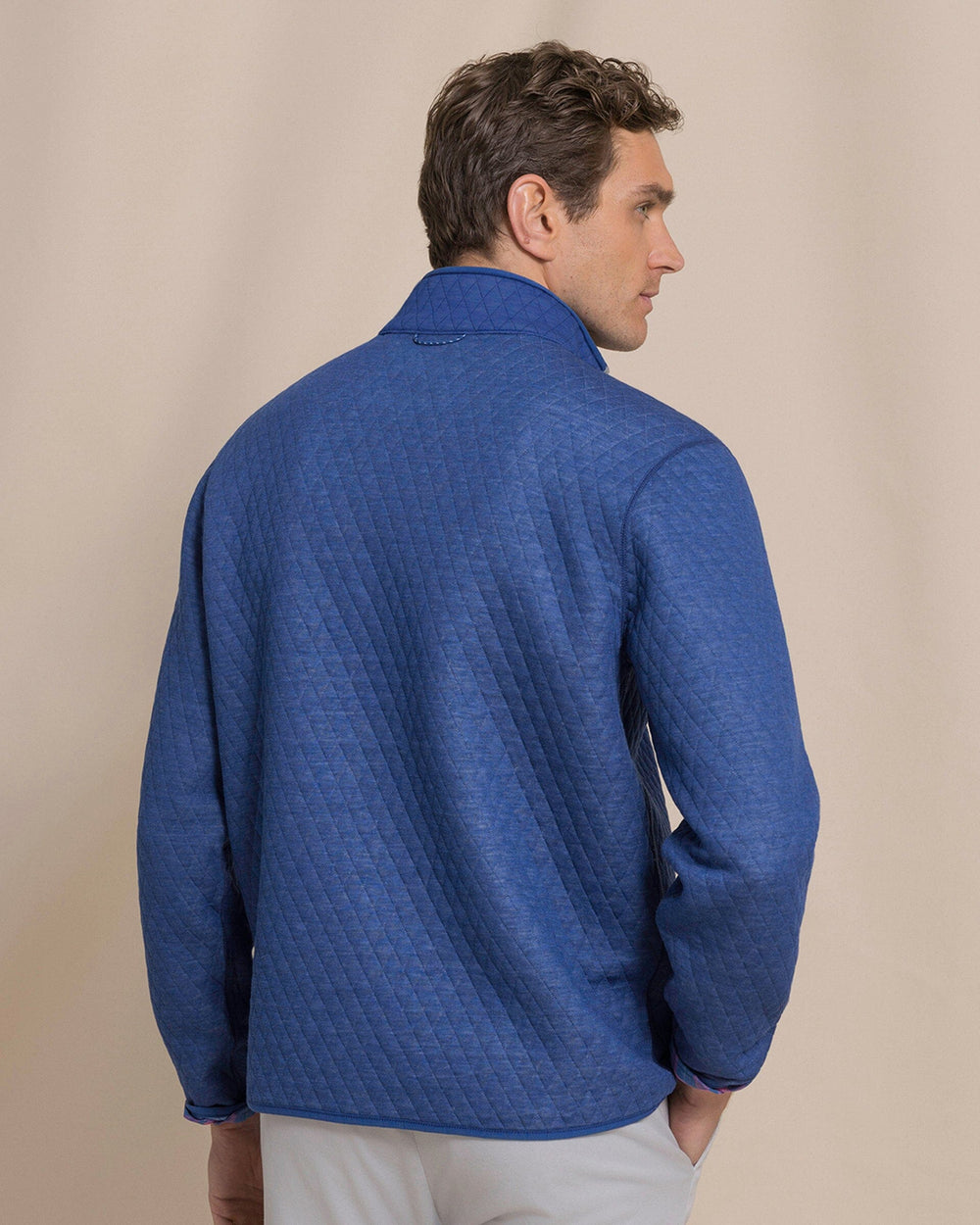 The back view of the Southern Tide Quilted Heather Reversible Quarter Snap by Southern Tide - Heather Ocean Channel