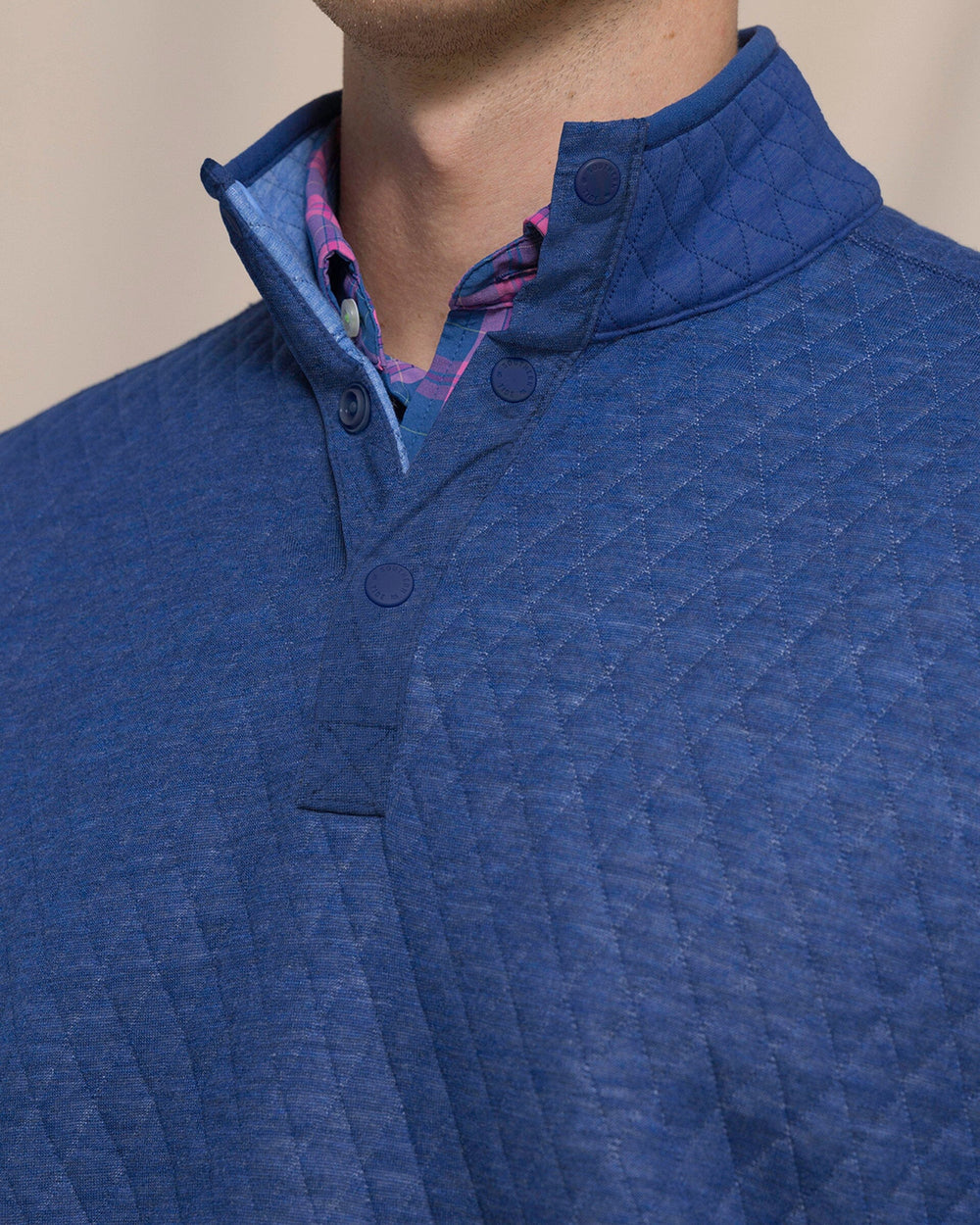 The detail view of the Southern Tide Quilted Heather Reversible Quarter Snap by Southern Tide - Heather Ocean Channel