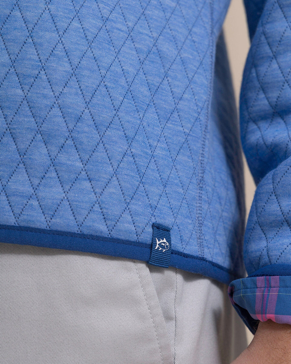 The detail view of the Southern Tide Quilted Heather Reversible Quarter Snap by Southern Tide - Heather Ocean Channel