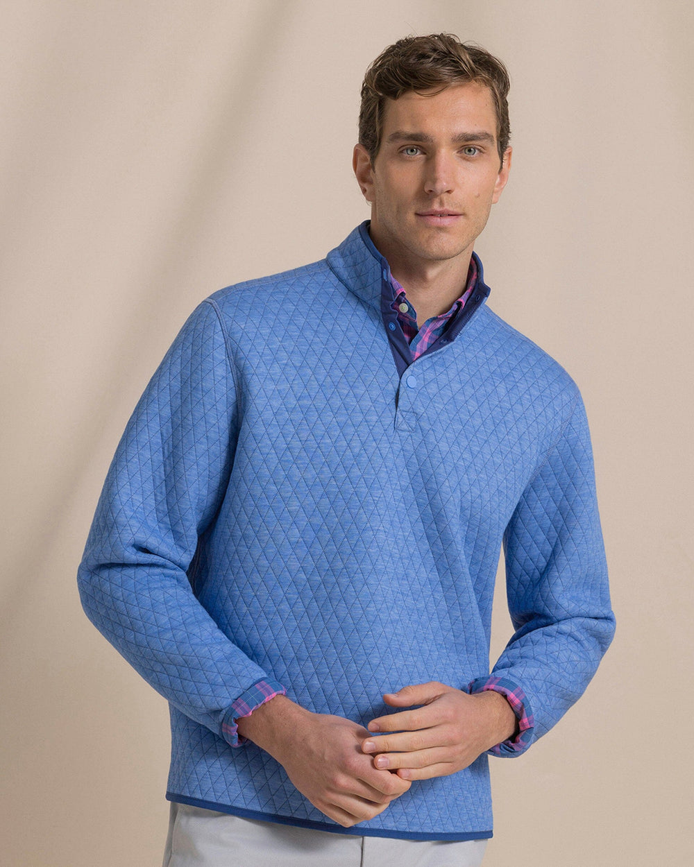 The front view of the Southern Tide Quilted Heather Reversible Quarter Snap by Southern Tide - Heather Ocean Channel