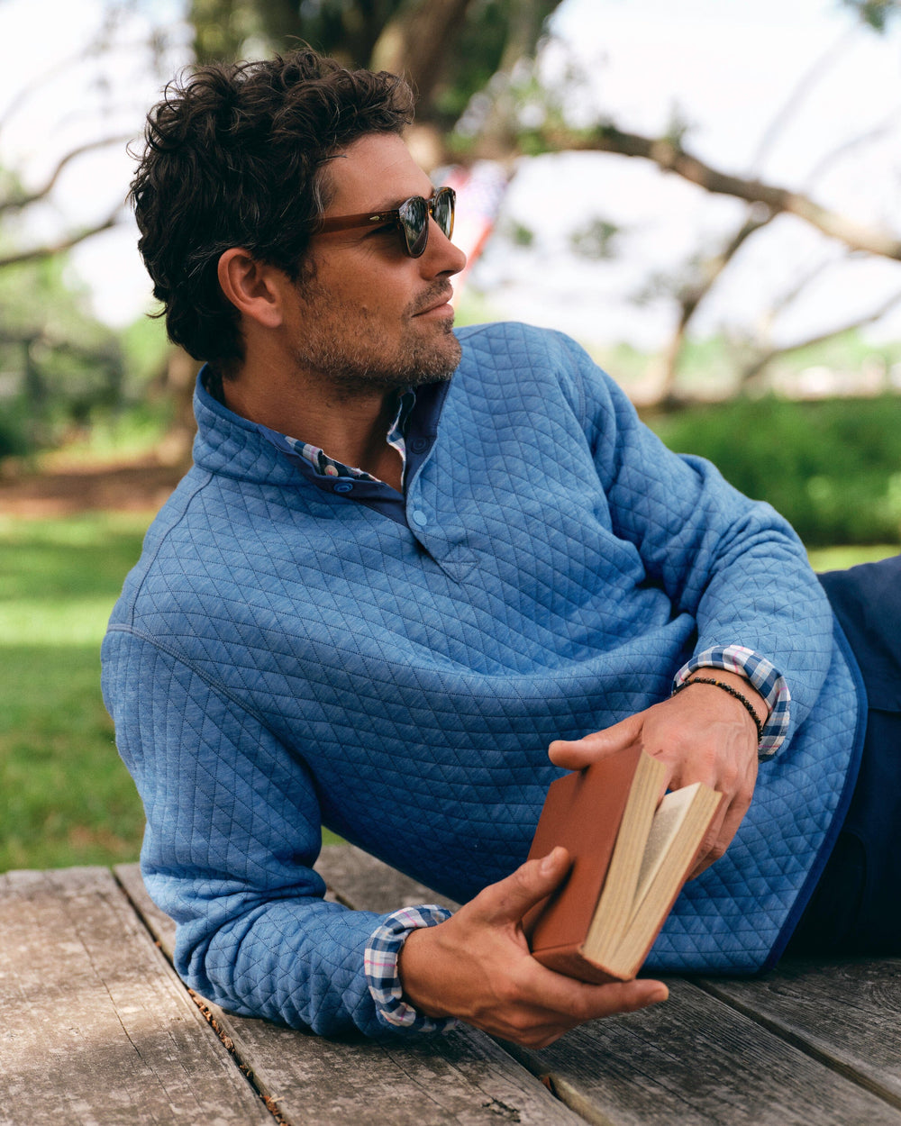 The lifestyle view of the Southern Tide Quilted Heather Reversible Quarter Snap by Southern Tide - Heather Ocean Channel