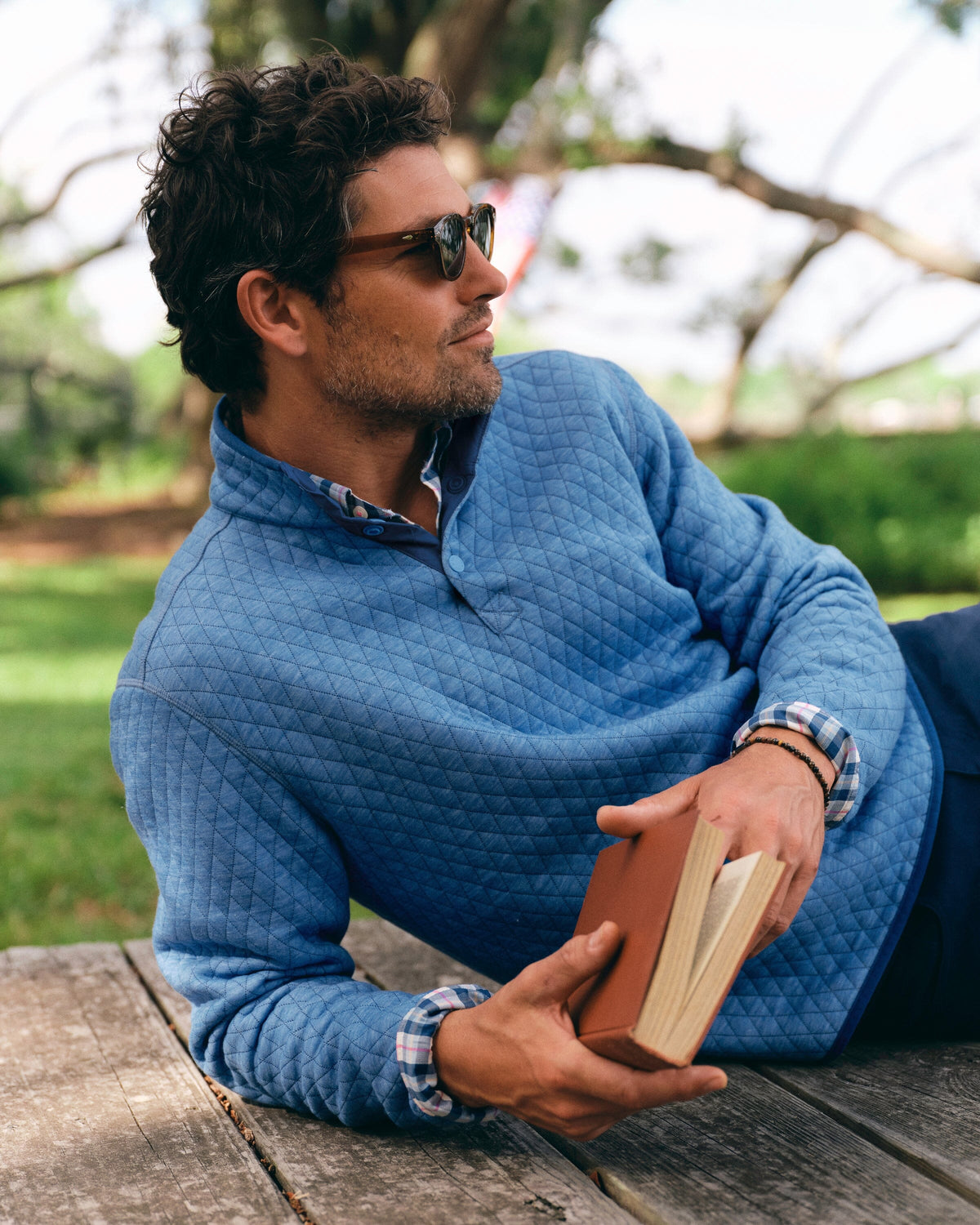 The lifestyle view of the Southern Tide Quilted Heather Reversible Quarter Snap by Southern Tide - Heather Ocean Channel