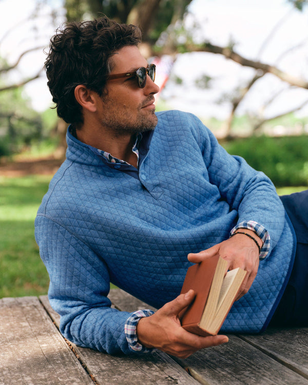 The lifestyle view of the Southern Tide Quilted Heather Reversible Quarter Snap by Southern Tide - Heather Ocean Channel