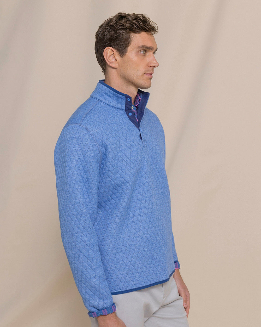 The side view of the Southern Tide Quilted Heather Reversible Quarter Snap by Southern Tide - Heather Ocean Channel