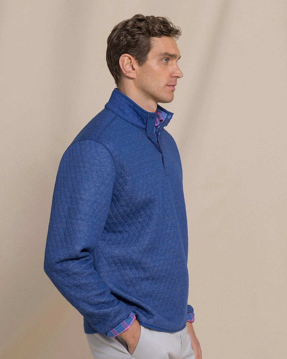 The side view of the Southern Tide Quilted Heather Reversible Quarter Snap by Southern Tide - Heather Ocean Channel