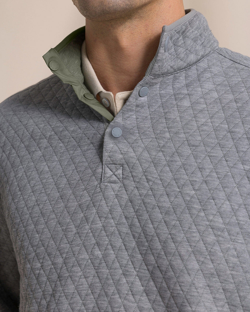 The detail view of the Southern Tide Quilted Heather Reversible Quarter Snap by Southern Tide - Heather Steel Grey