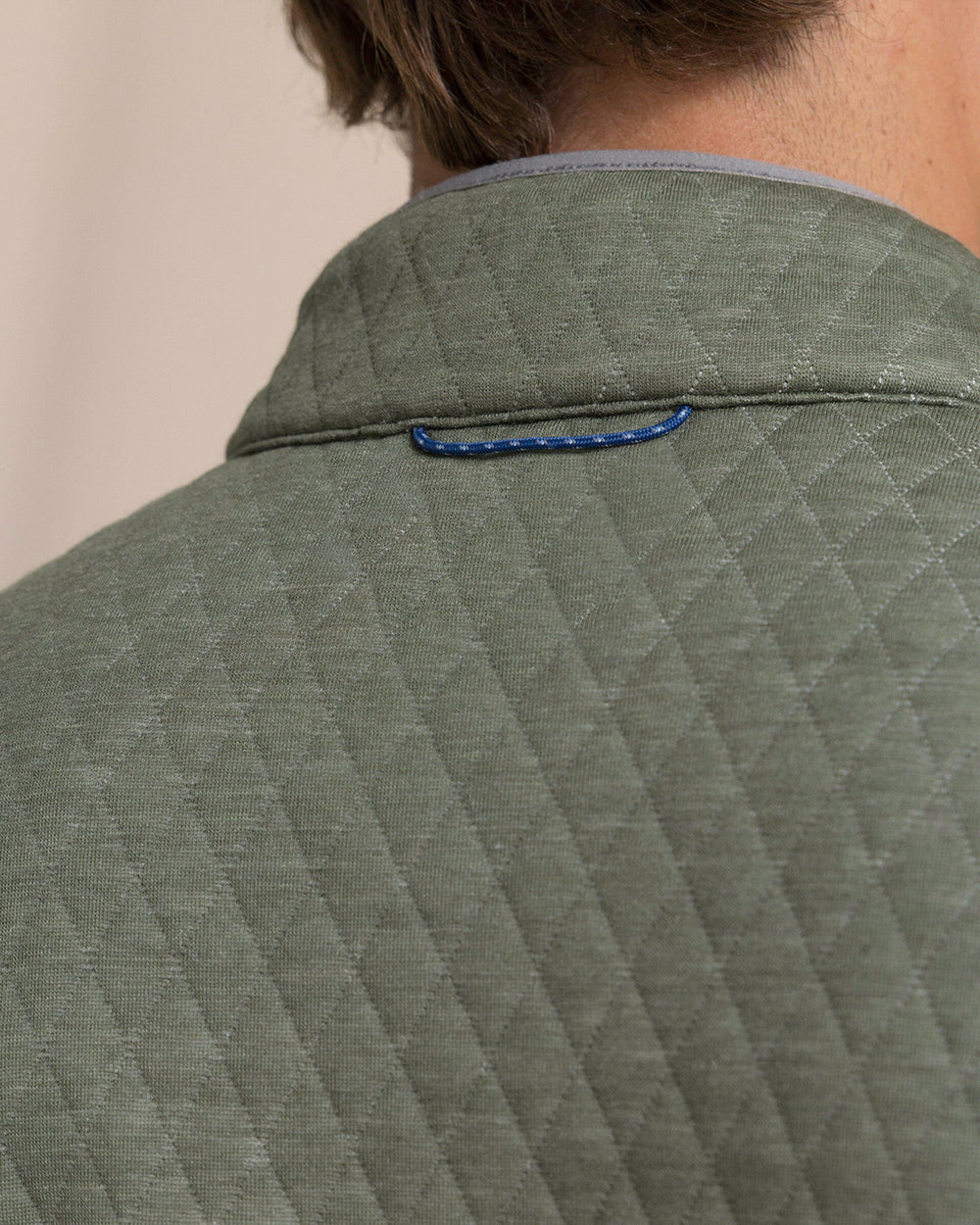 The detail view of the Southern Tide Quilted Heather Reversible Quarter Snap by Southern Tide - Heather Steel Grey