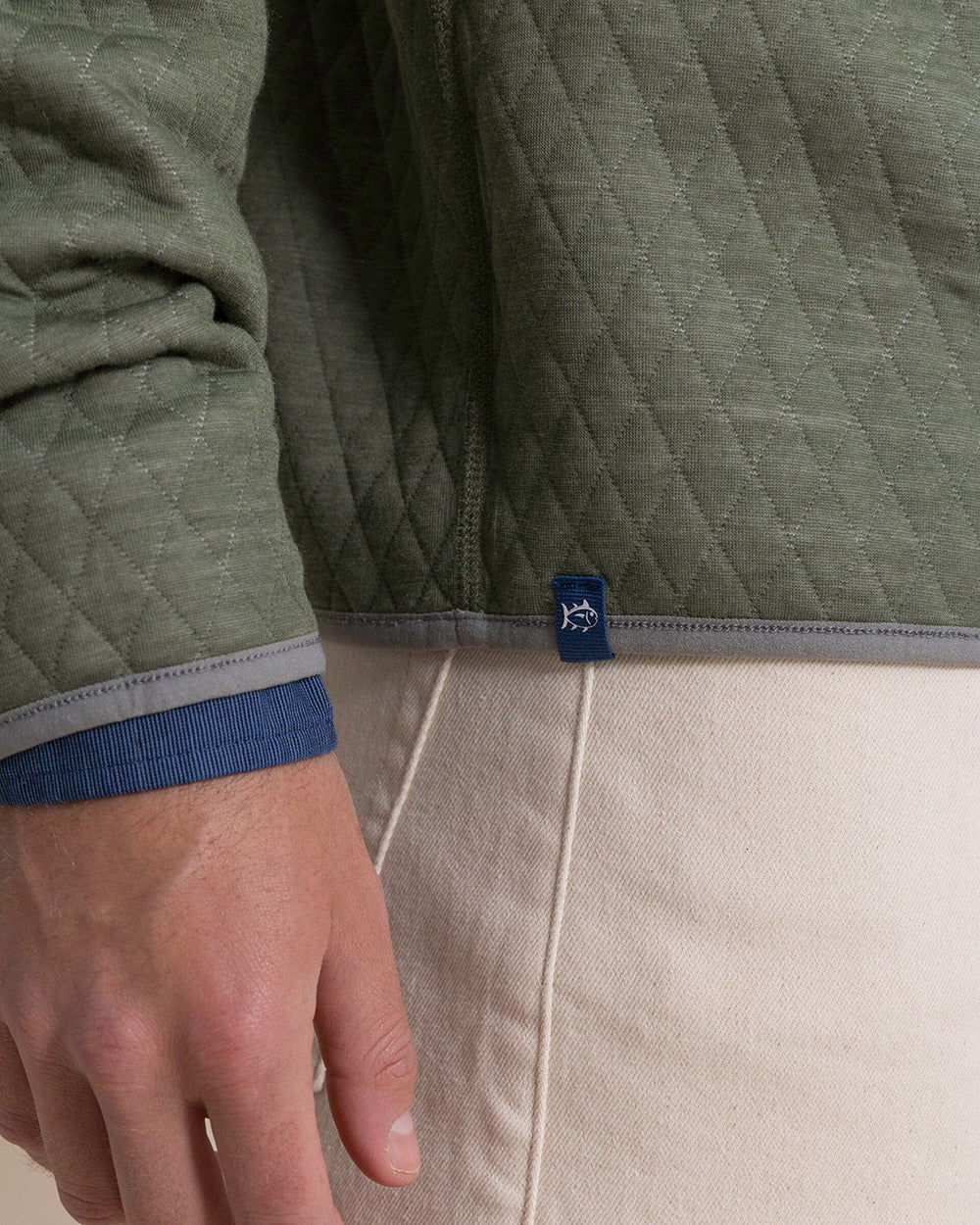 The detail view of the Southern Tide Quilted Heather Reversible Quarter Snap by Southern Tide - Heather Steel Grey