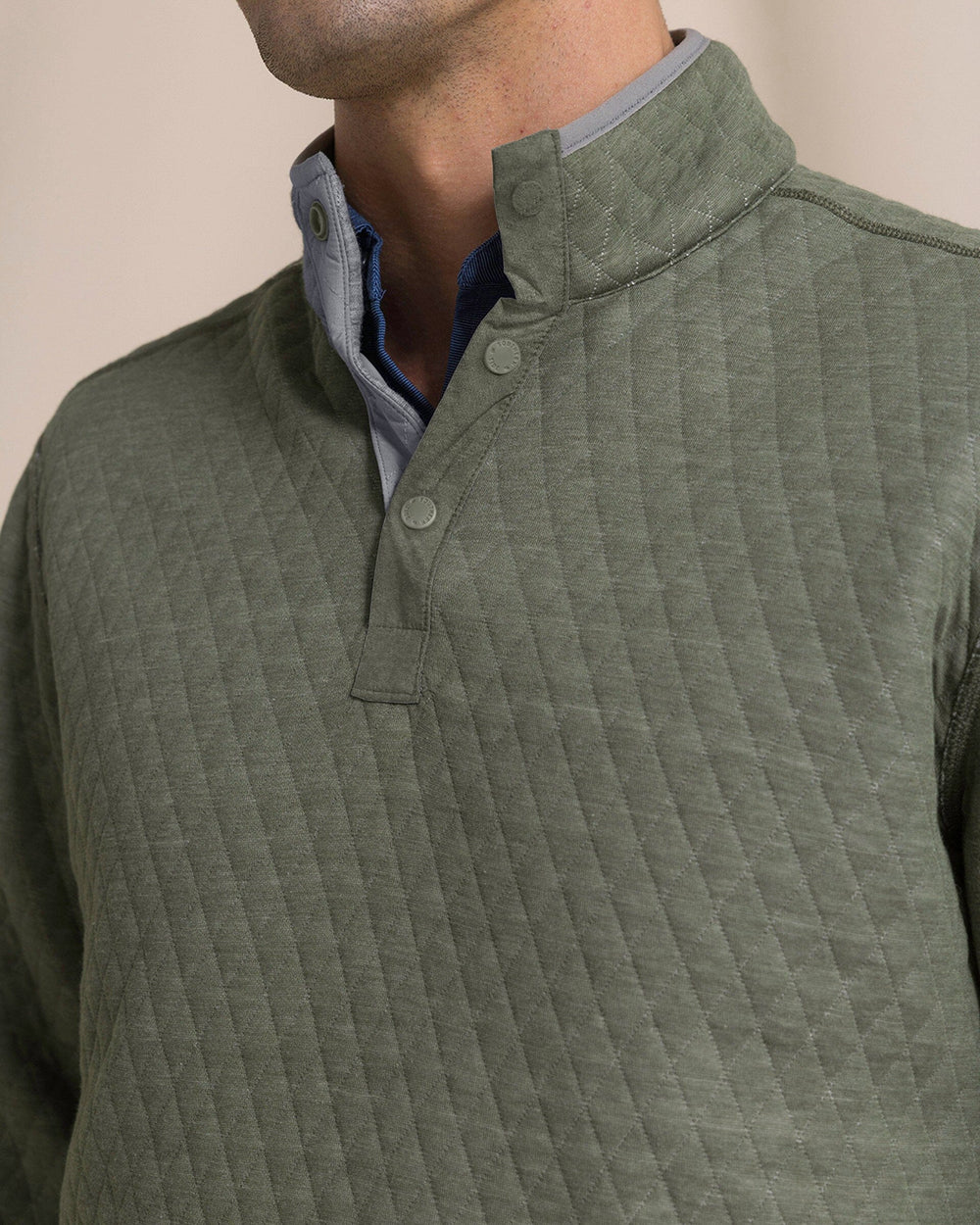 The detail view of the Southern Tide Quilted Heather Reversible Quarter Snap by Southern Tide - Heather Steel Grey