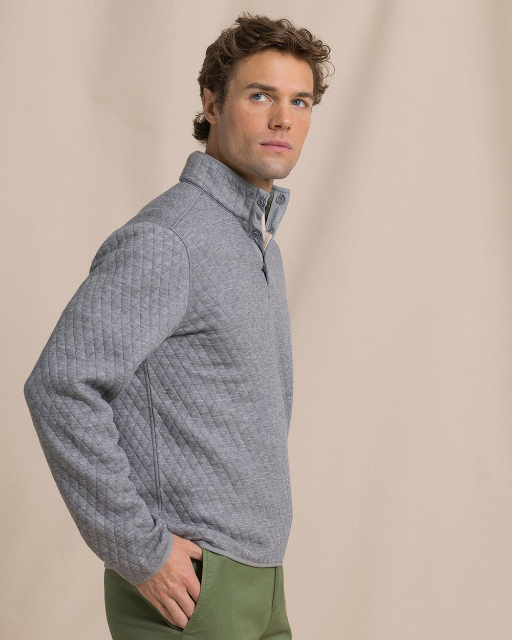 The side view of the Southern Tide Quilted Heather Reversible Quarter Snap by Southern Tide - Heather Steel Grey