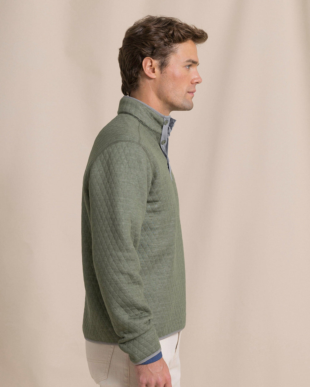 The side view of the Southern Tide Quilted Heather Reversible Quarter Snap by Southern Tide - Heather Steel Grey