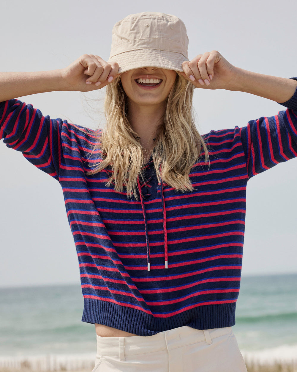 The lifestyle view of the Southern Tide Raelyn Tie Neck Sweater by Southern Tide - Grenadine Red
