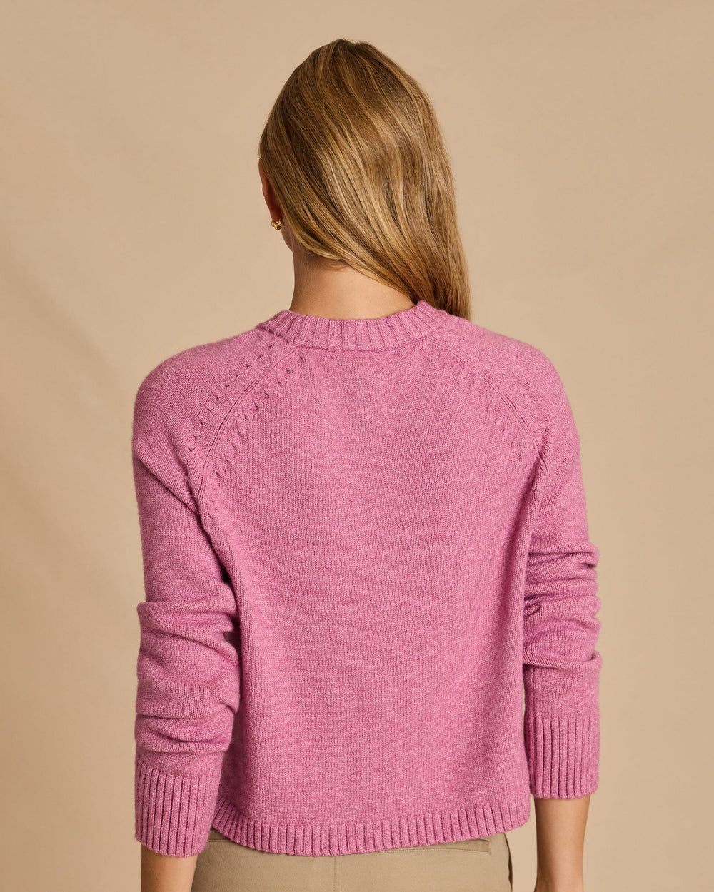 The back view of the Southern Tide Raglan Crewneck Sweater by Southern Tide - Deep Orchid