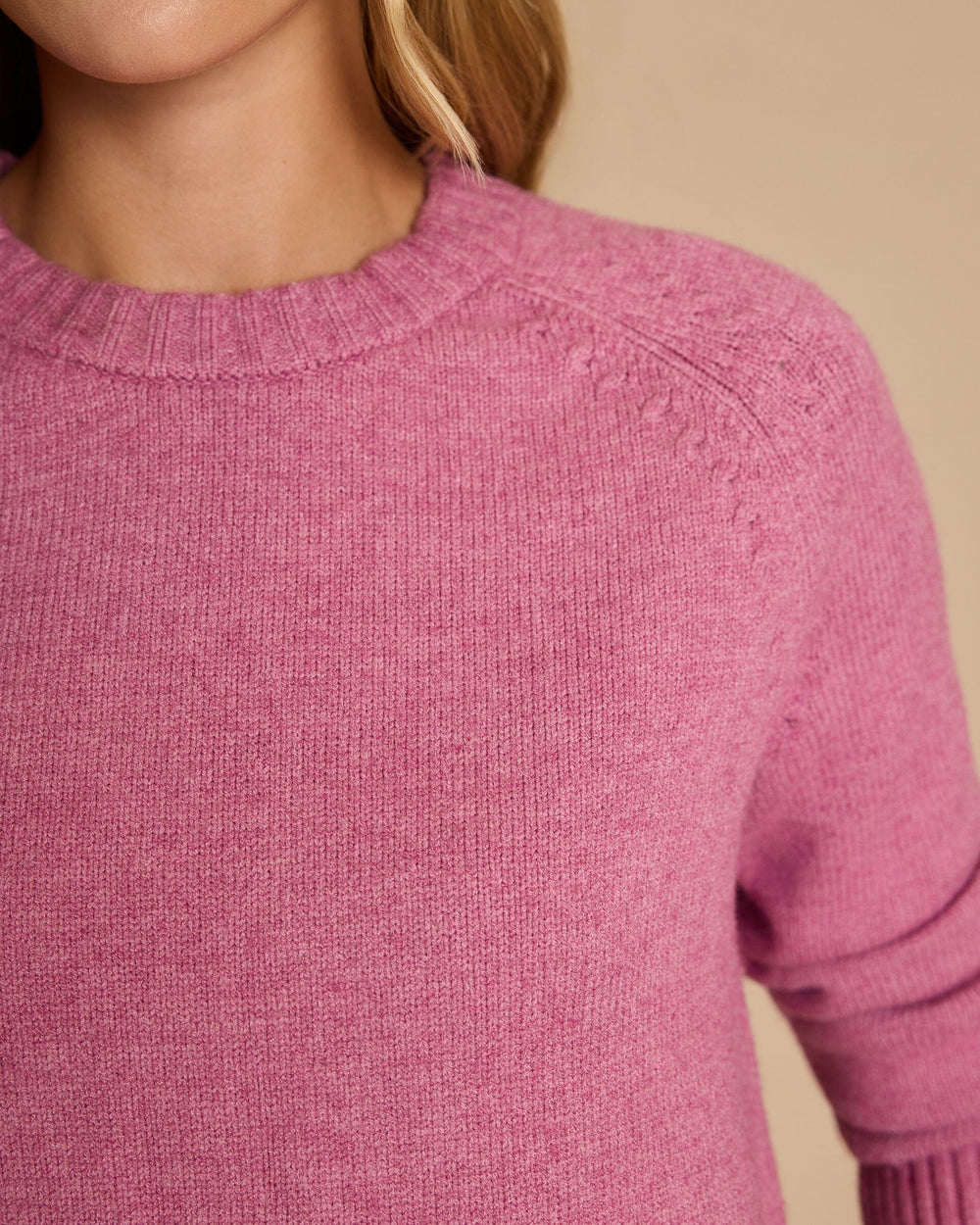 The detail view of the Southern Tide Raglan Crewneck Sweater by Southern Tide - Deep Orchid