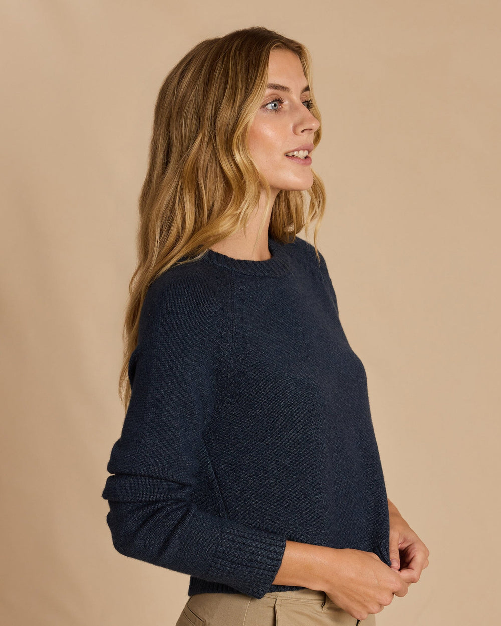 The side view of the Southern Tide Raglan Crewneck Sweater by Southern Tide - Dress Blue