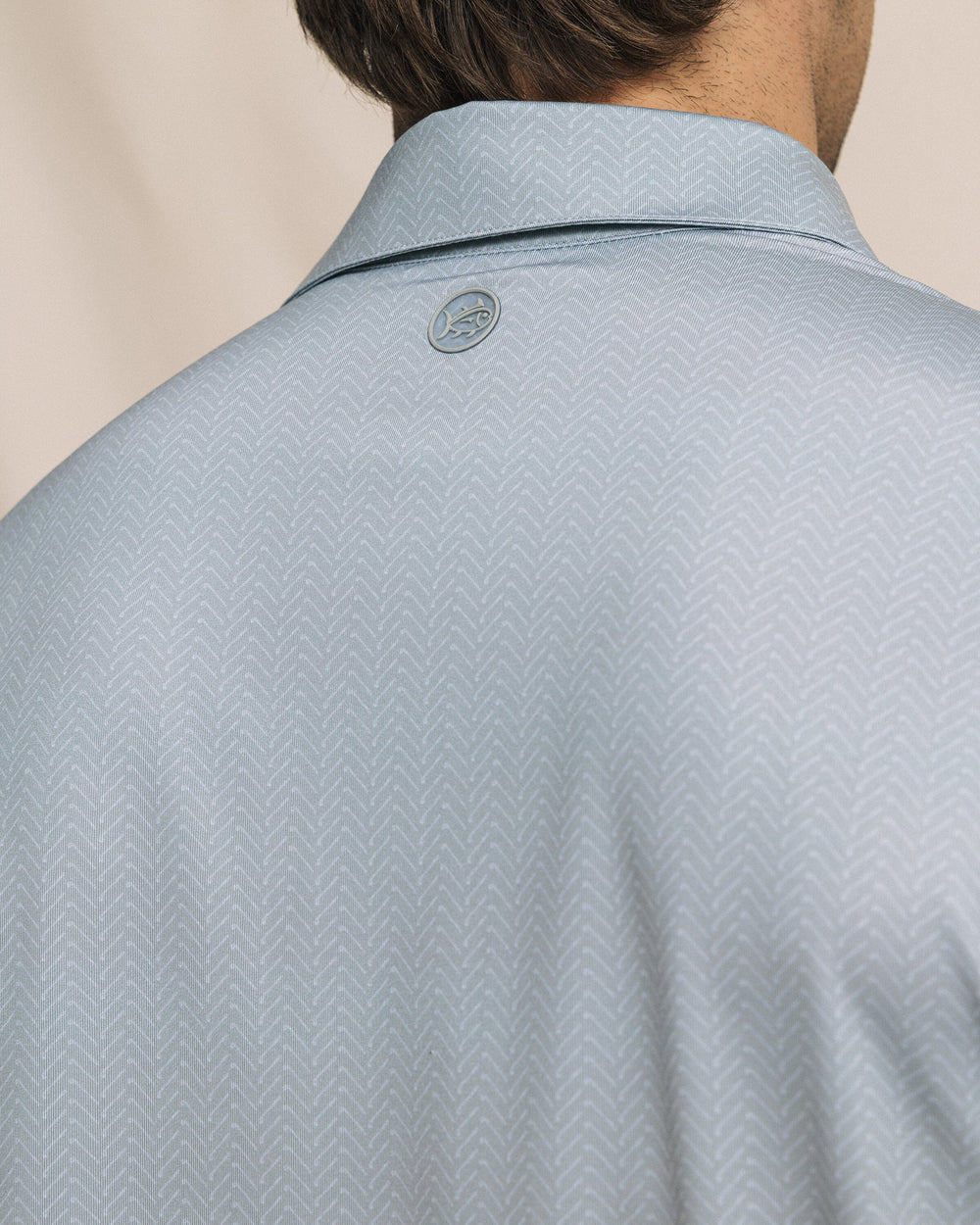 The detail view of the Southern Tide Driver Raise The Par Printed Polo by Southern Tide - Steel