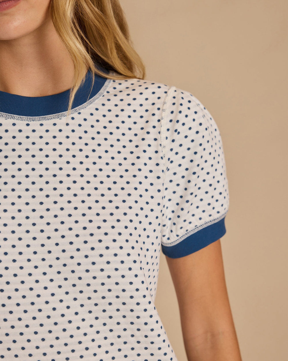 The detail view of the Southern Tide Reversible Stripe and Dot Top by Southern Tide - Star White