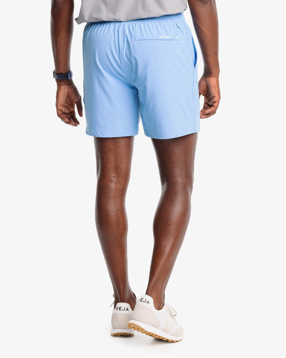 The model back view of the Men's Rip Channel 6 Inch Performance Short by Southern Tide - Boat Blue