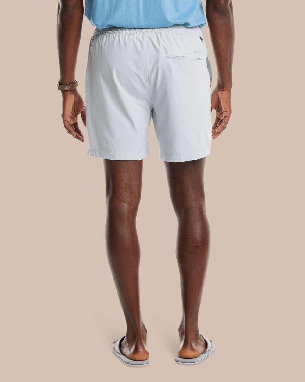 The model back view of the Men's Rip Channel 6 Inch Performance Short by Southern Tide - Seagull Grey