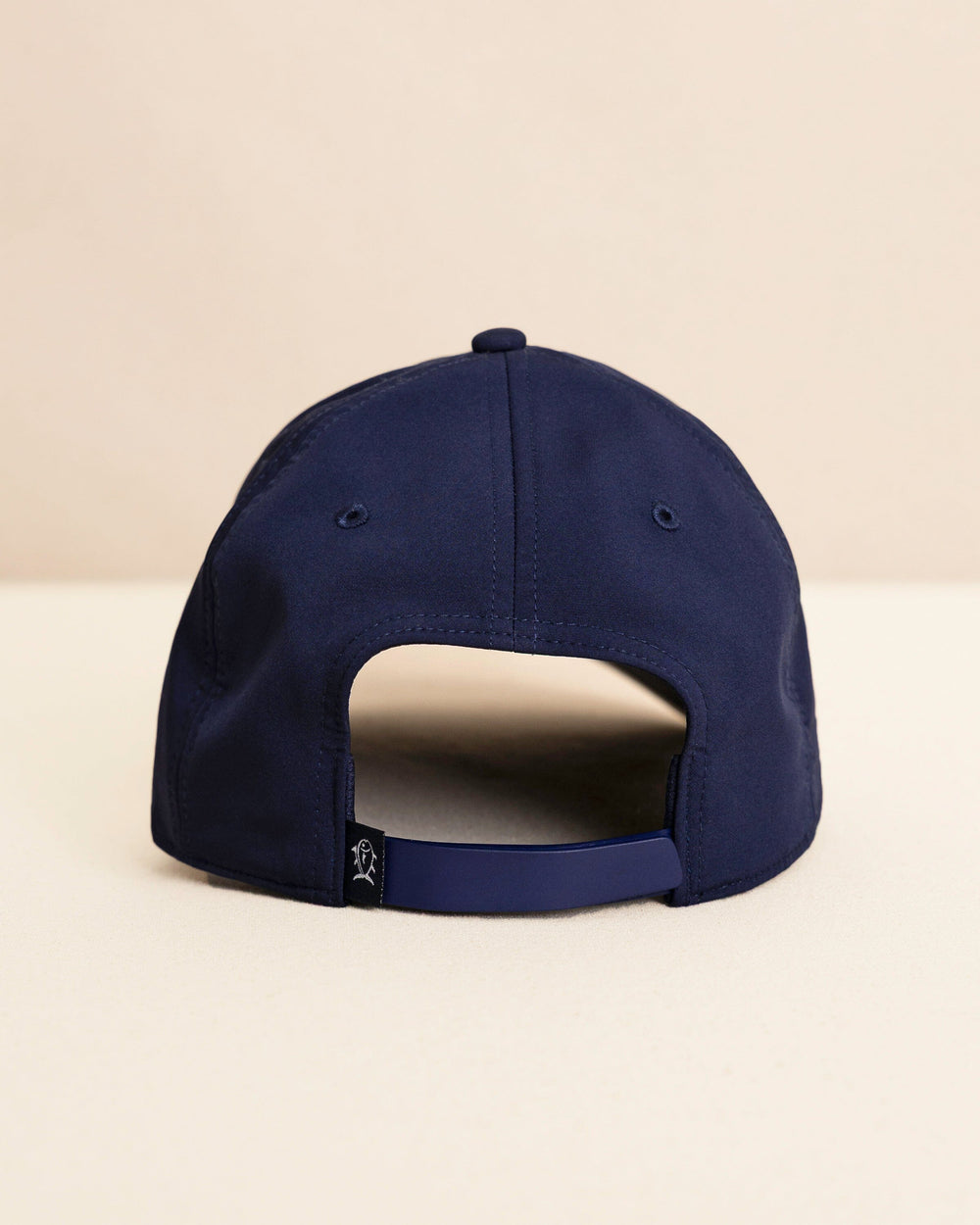 The back view of the Southern Tide Rubber Skipjack Patch Performance Hat by Southern Tide - Navy