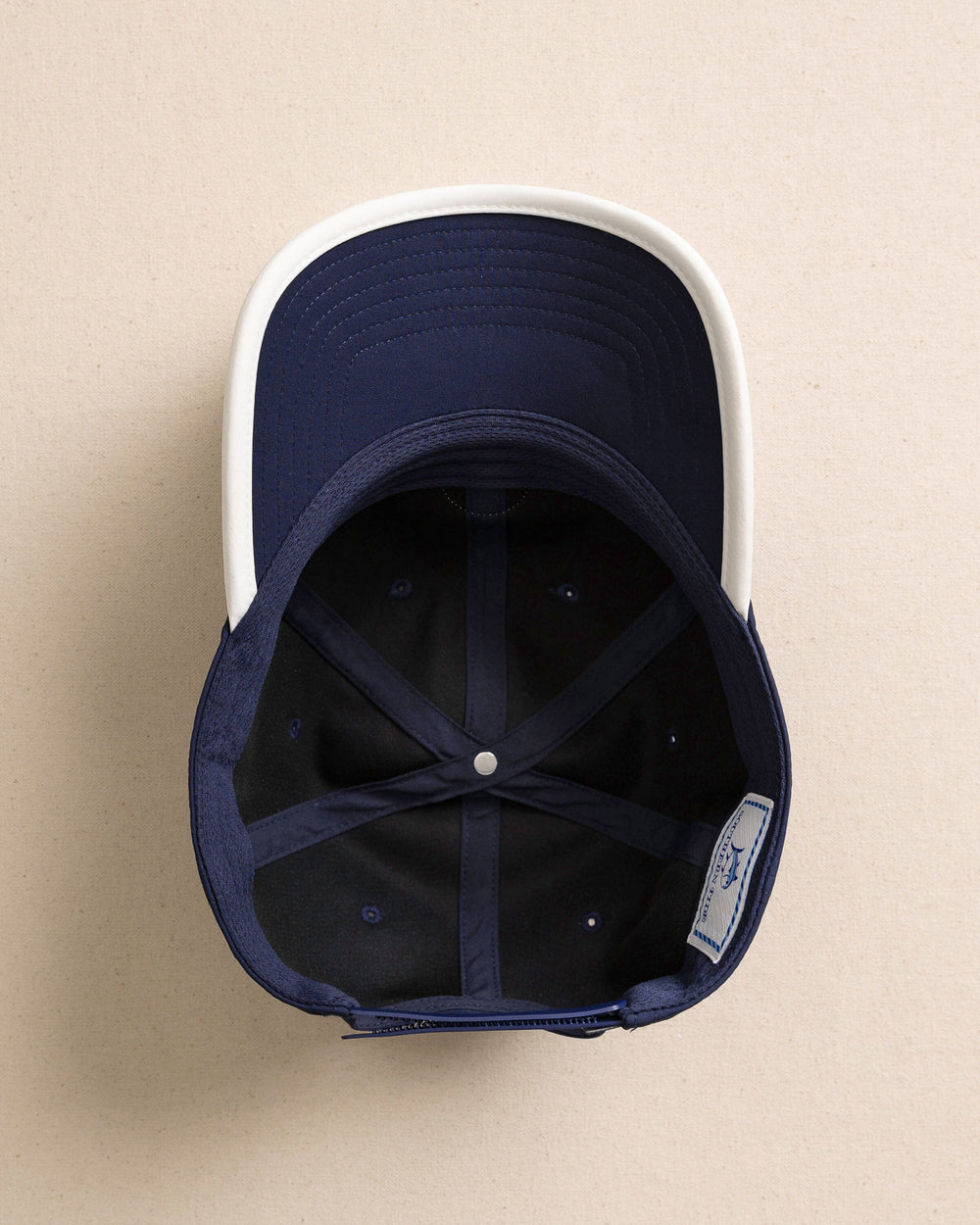 The under view of the Southern Tide Rubber Skipjack Patch Performance Hat by Southern Tide - Navy