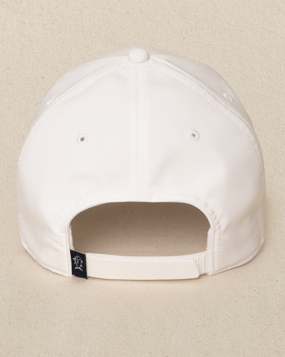 The back view of the Southern Tide Rubber Skipjack Patch Performance Hat by Southern Tide - White