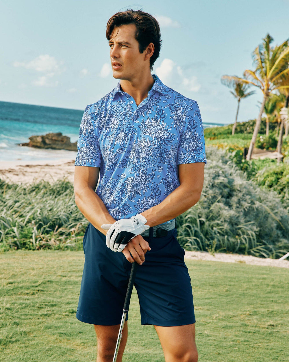 The lifestyle view of the Ryder Croc and Lock It Polo Shirt by Southern Tide - Boca Blue
