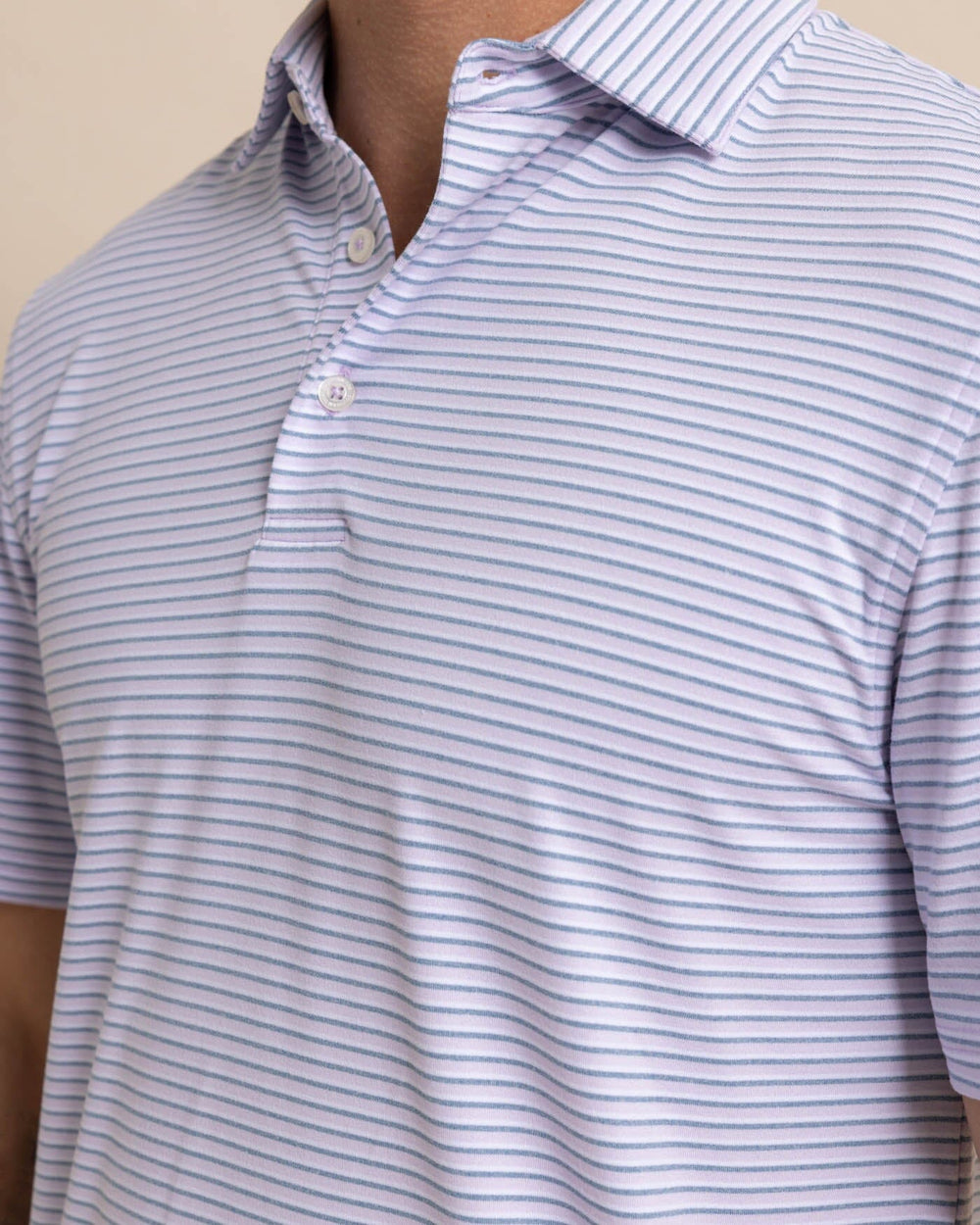The detail view of the Southern Tide Ryder Heather Halls Performance Polo by Southern Tide - Heather Orchid Petal